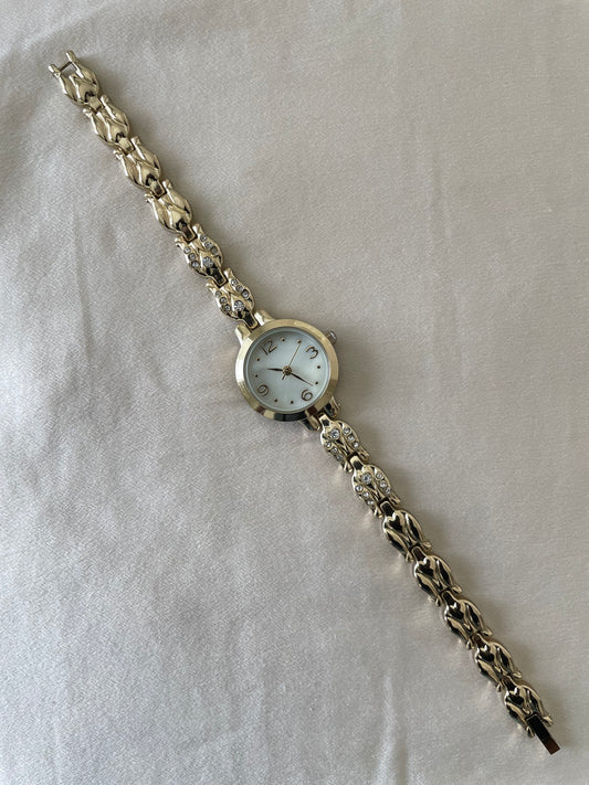 Dainty gold watch with bejeweled detail